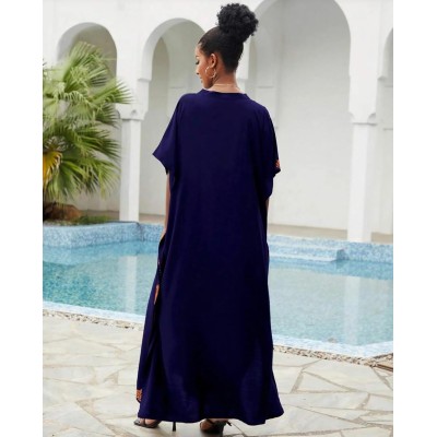 Bohemian Navy Floral Caftan Dress - Plus Size Beach Coverup with Embroidery Plus size woman wearing navy floral caftan dress with embroidery at beach