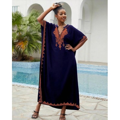 Bohemian Navy Floral Caftan Dress - Plus Size Beach Coverup with Embroidery Plus size woman wearing navy floral caftan dress with embroidery at beach
