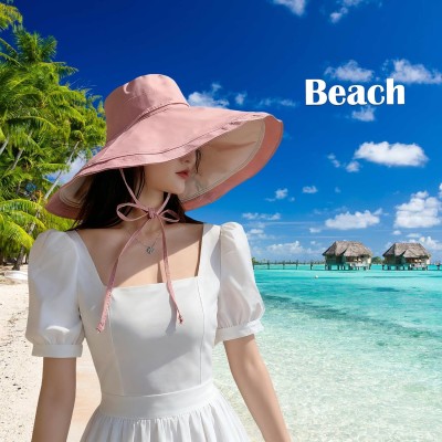 Women in reversible wide brim sun hat with UPF 50+ protection