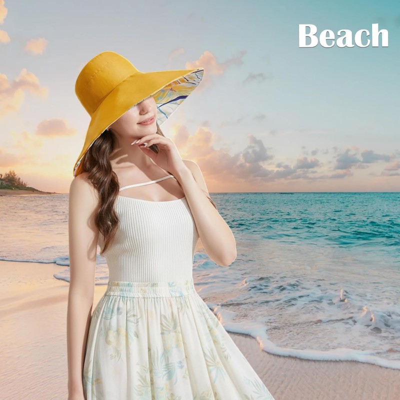 Woman wearing a reversible wide brim sun hat with UPF50+ protection at the beach