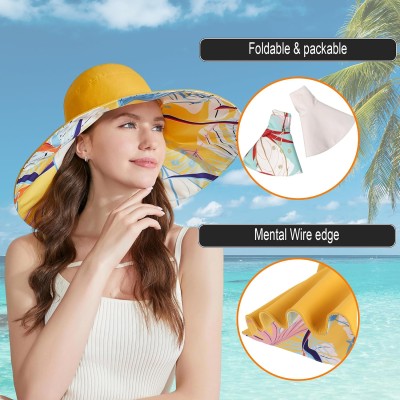 Woman wearing a reversible wide brim sun hat with UPF50+ protection at the beach