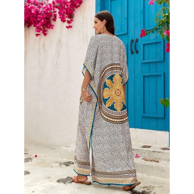 Woman wearing plus size bohemian floral kaftan dress as swim coverup