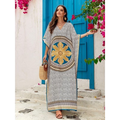 Woman wearing plus size bohemian floral kaftan dress as swim coverup