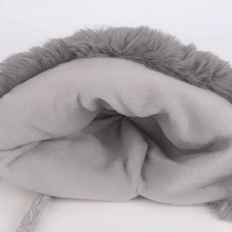 Women's gray knit winter ponytail beanie with sherpa lining, ear flaps, and 3 pompoms