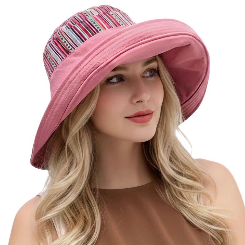 Women's pink reversible wide brim sun hat with UPF 50+ for beach and gardening