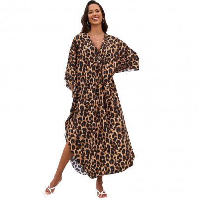 Bohemian Leopard Caftan Dress Coverup Plus size woman wearing bohemian leopard print caftan dress as swim coverup on beach