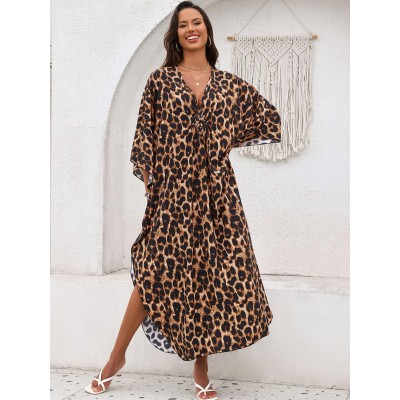 Bohemian Leopard Caftan Dress Coverup Plus size woman wearing bohemian leopard print caftan dress as swim coverup on beach