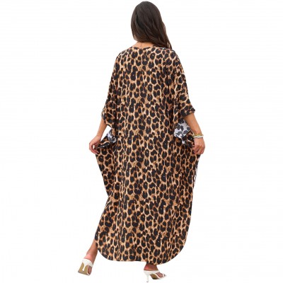 Bohemian Leopard Caftan Dress Coverup Plus size woman wearing bohemian leopard print caftan dress as swim coverup on beach