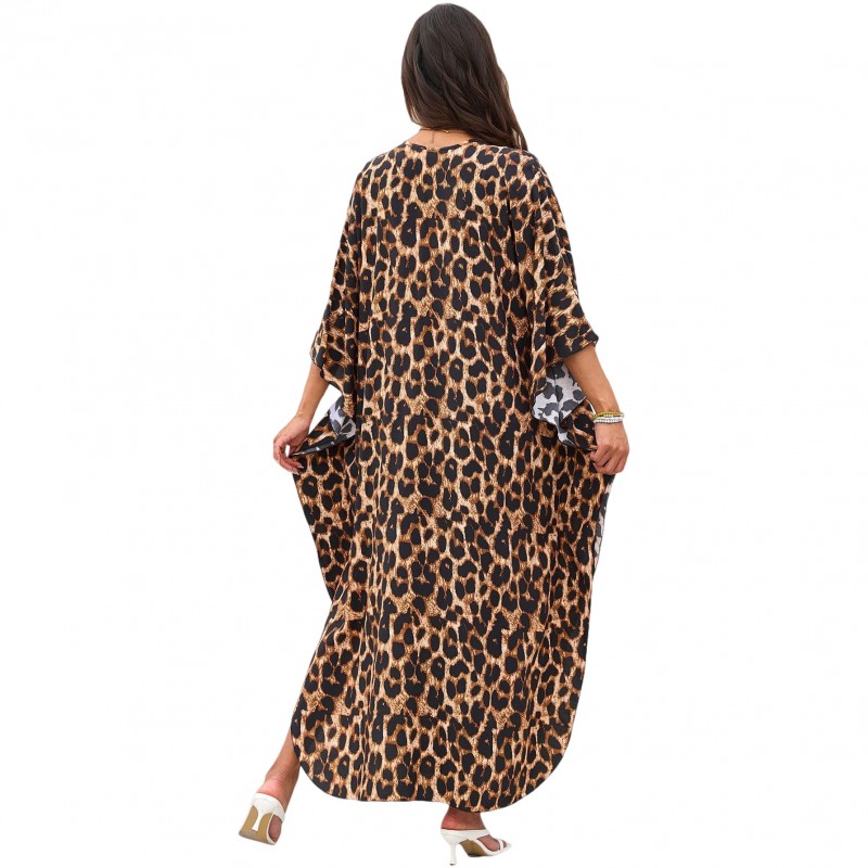 Bohemian Leopard Caftan Dress Coverup Plus size woman wearing bohemian leopard print caftan dress as swim coverup on beach