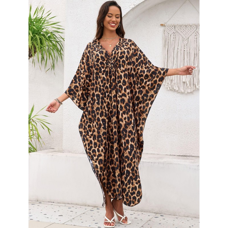 Bohemian Leopard Caftan Dress Coverup Plus size woman wearing bohemian leopard print caftan dress as swim coverup on beach