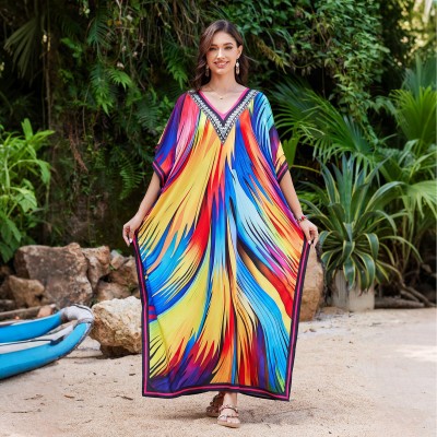 Plus Size Colorful Striped Caftan - Bohemian Beach Cover Up Woman in colorful striped caftan dress with plants and beach scenery