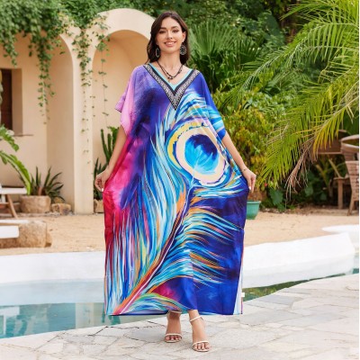 Plus Size Peacock Feather Kaftan - Pool Cover Up Dress Woman in peacock feather print kaftan dress by pool with plants