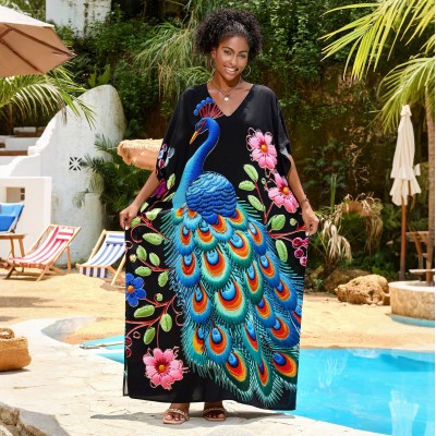 Tropical Bohemian Kaftan Dress with Peacock Print Woman in black floral print V-neck kaftan dress by pool