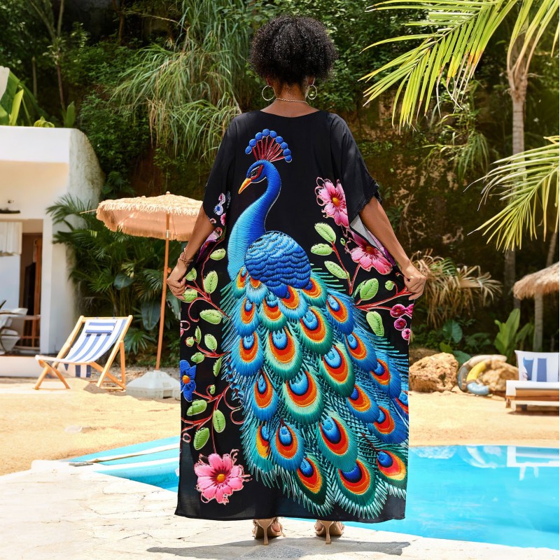 Tropical Bohemian Kaftan Dress with Peacock Print Woman in black floral print V-neck kaftan dress by pool