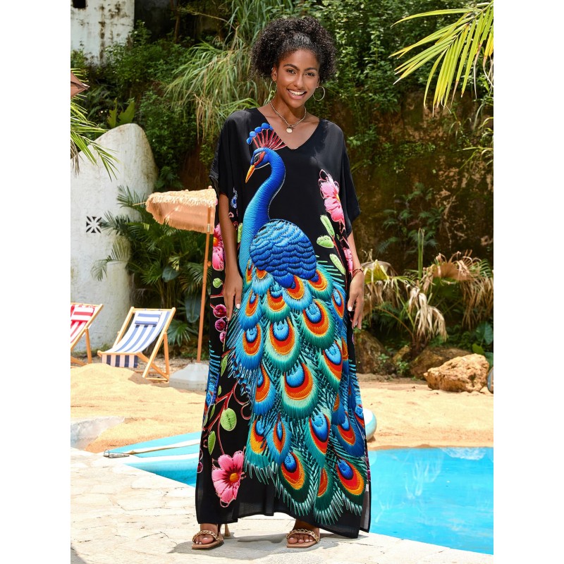 Tropical Bohemian Kaftan Dress with Peacock Print Woman in black floral print V-neck kaftan dress by pool