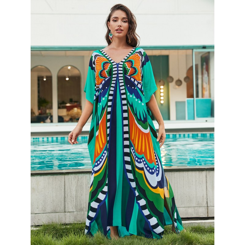 Bohemian Ethnic Print Kaftan Dress – Women's Poolside Cover Up & Loungewear Woman in colorful bohemian ethnic print kaftan dress with batwing sleeves and V-neck standing by a pool