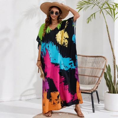 Vibrant Splatter Caftan Dress - Resort Wear & Swim Cover Up Plus size woman in black bohemian splatter print caftan dress beach cover up