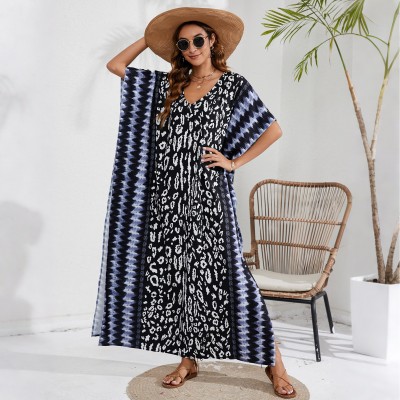 Bohemian Leopar Kaftan Dress - Gradient Stripe Swim Cover Up & Resort Wear Plus size woman in black leopard print kaftan dress with blue gradient stripes beach cover up