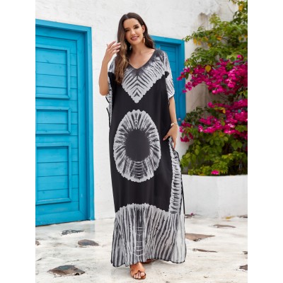 Bohemian Abstract Art Print Caftan Dress: Women's Beach Cover Up with Batwing Sleeves Woman in black and white bohemian abstract art print caftan dress with batwing sleeves and V-neck standing in front of blue door