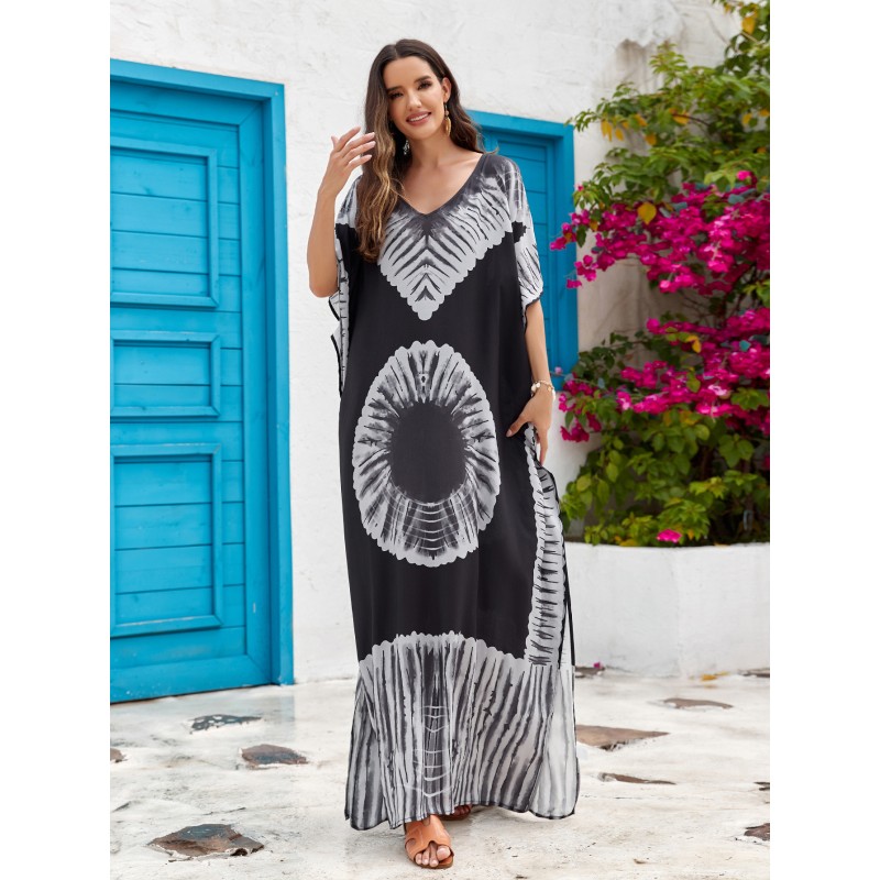 Bohemian Abstract Art Print Caftan Dress: Women's Beach Cover Up with Batwing Sleeves Woman in black and white bohemian abstract art print caftan dress with batwing sleeves and V-neck standing in front of blue door