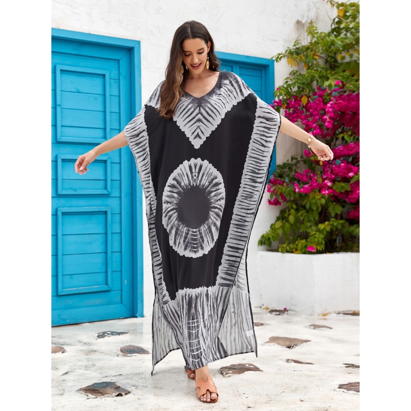 Bohemian Abstract Art Print Caftan Dress: Women's Beach Cover Up with Batwing Sleeves Woman in black and white bohemian abstract art print caftan dress with batwing sleeves and V-neck standing in front of blue door