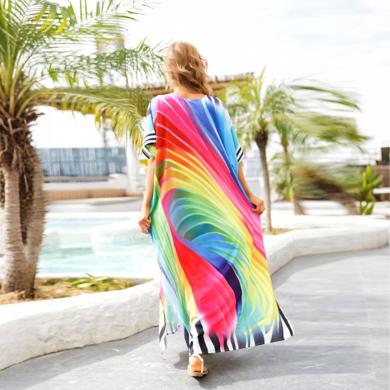 Rainbow Striped Kaftan Dress: Plus Size Beach Cover Up for Women Woman in vibrant rainbow striped plus size kaftan dress with V-neck