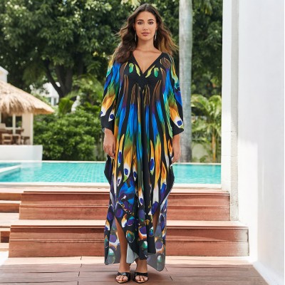 Artistic Resort Kaftan: Beach Cover Up, Lounge Dress & Poolside Elegance Plus size woman in black floral kaftan dress at luxury resort