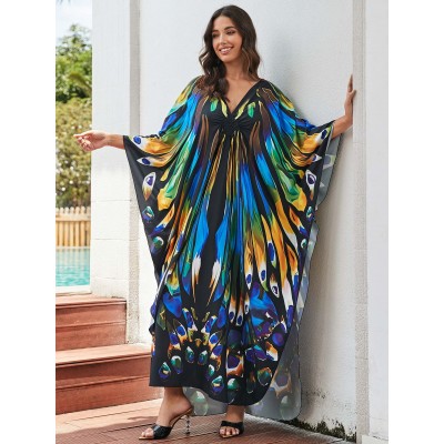 Artistic Resort Kaftan: Beach Cover Up, Lounge Dress & Poolside Elegance Plus size woman in black floral kaftan dress at luxury resort