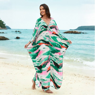Plus Size Caftan Dress Women’s Beach Cover Up with Vibrant Print Woman in plus size caftan dress with vibrant green pink print standing on beach