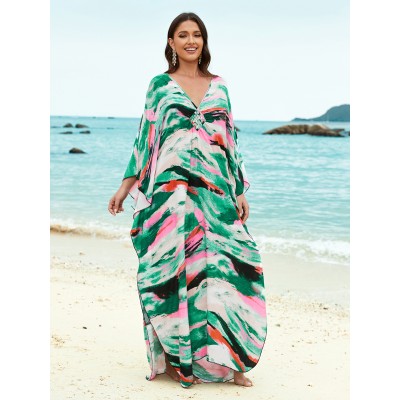 Plus Size Caftan Dress Women’s Beach Cover Up with Vibrant Print Woman in plus size caftan dress with vibrant green pink print standing on beach