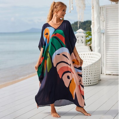 Plus Size Abstract Art Kaftan - Beach Cover Up Dress Woman in navy blue leaf print kaftan dress at beach