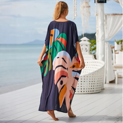 Plus Size Abstract Art Kaftan - Beach Cover Up Dress Woman in navy blue leaf print kaftan dress at beach