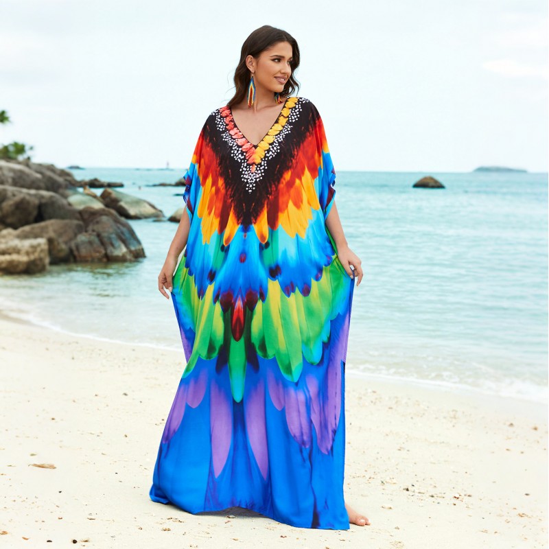 Plus Size Feather Print Caftan Dress - Beach Cover Up Woman wearing bohemian feather print caftan dress at beach