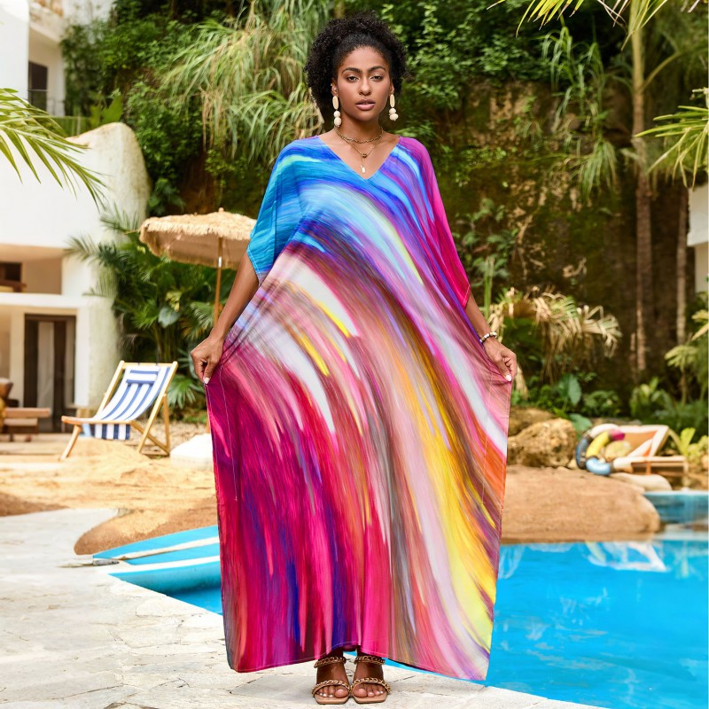Vibrant Stellar Trajectory Print Kaftan Dress for Women - Poolside Beach Cover Up Woman wearing vibrant stellar trajectory print kaftan dress, loose fit maxi with batwing sleeves and V-neck, standing by poolside
