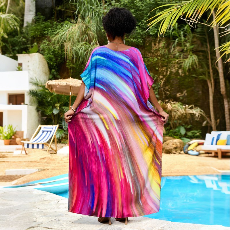 Vibrant Stellar Trajectory Print Kaftan Dress for Women - Poolside Beach Cover Up Woman wearing vibrant stellar trajectory print kaftan dress, loose fit maxi with batwing sleeves and V-neck, standing by poolside