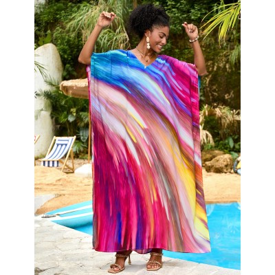 Vibrant Stellar Trajectory Print Kaftan Dress for Women - Poolside Beach Cover Up Woman wearing vibrant stellar trajectory print kaftan dress, loose fit maxi with batwing sleeves and V-neck, standing by poolside