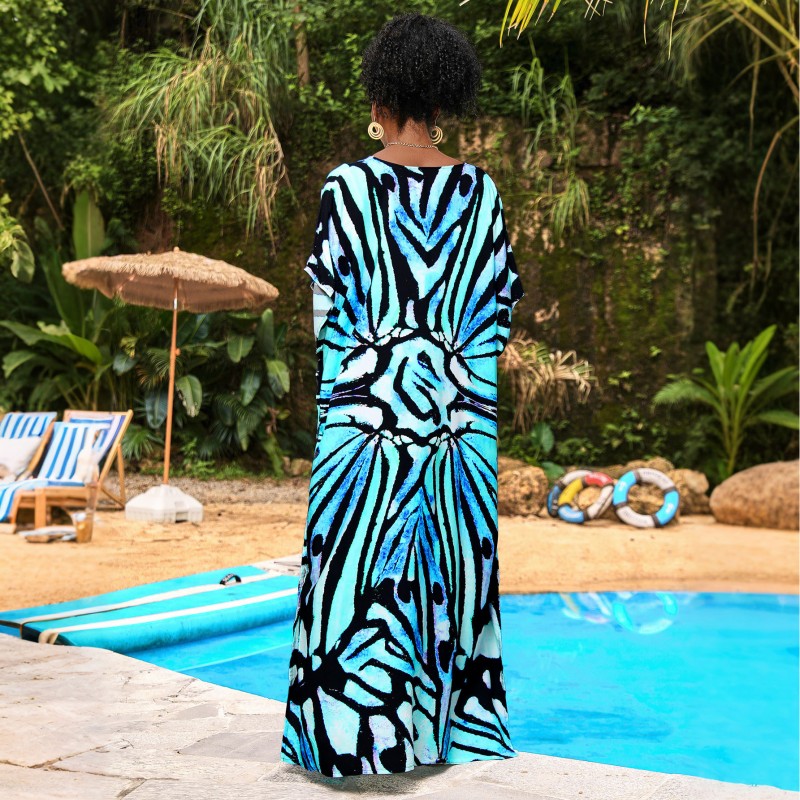 Abstract Pattern Caftan Maxi Dress – Bohemian Resort Wear in Blue Woman in abstract patterned caftan maxi dress with blue and black design