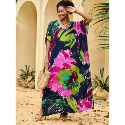 Woman wearing colorful bohemian V neck kaftan maxi dress by the pool   