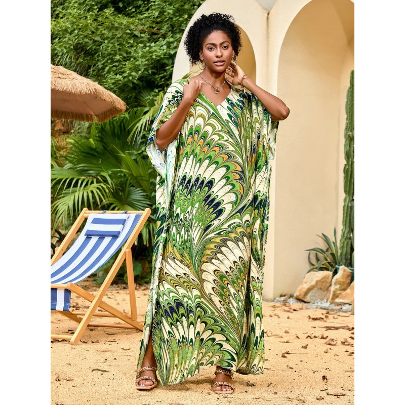 Feather Print Caftan Maxi Dress – Bohemian Resort Outfit in Green Woman wearing feather print caftan maxi dress with green abstract pattern