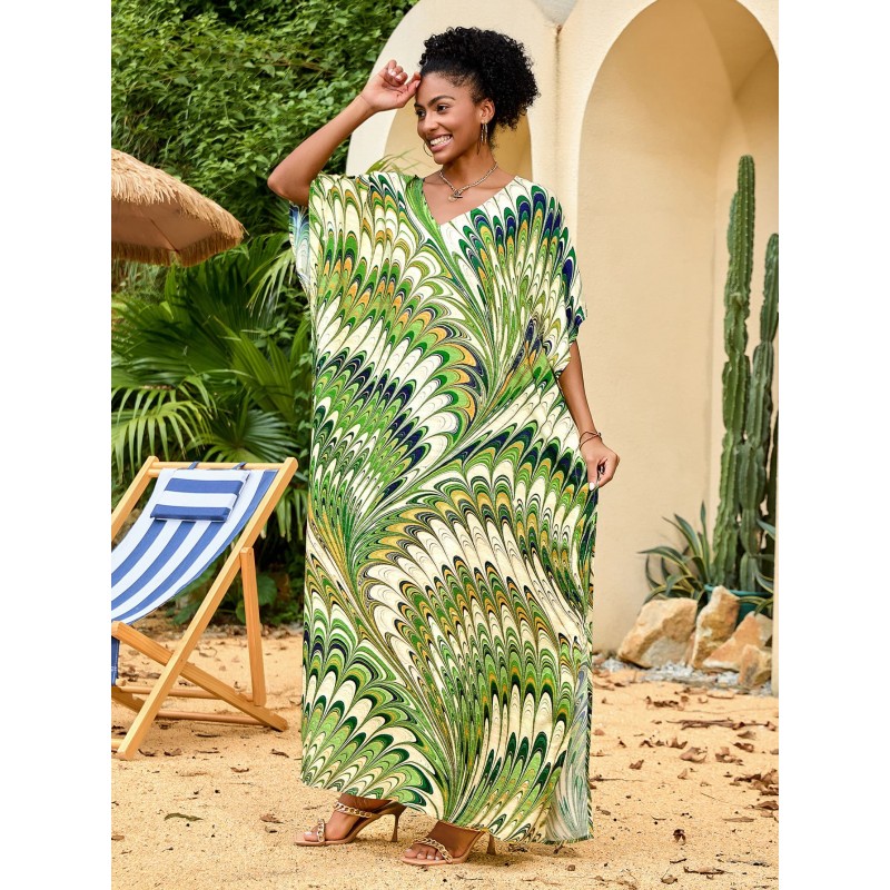 Feather Print Caftan Maxi Dress – Bohemian Resort Outfit in Green Woman wearing feather print caftan maxi dress with green abstract pattern